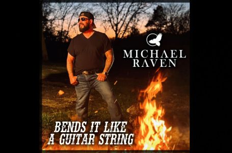 Michael Raven – “Bends It Like A Guitar String”